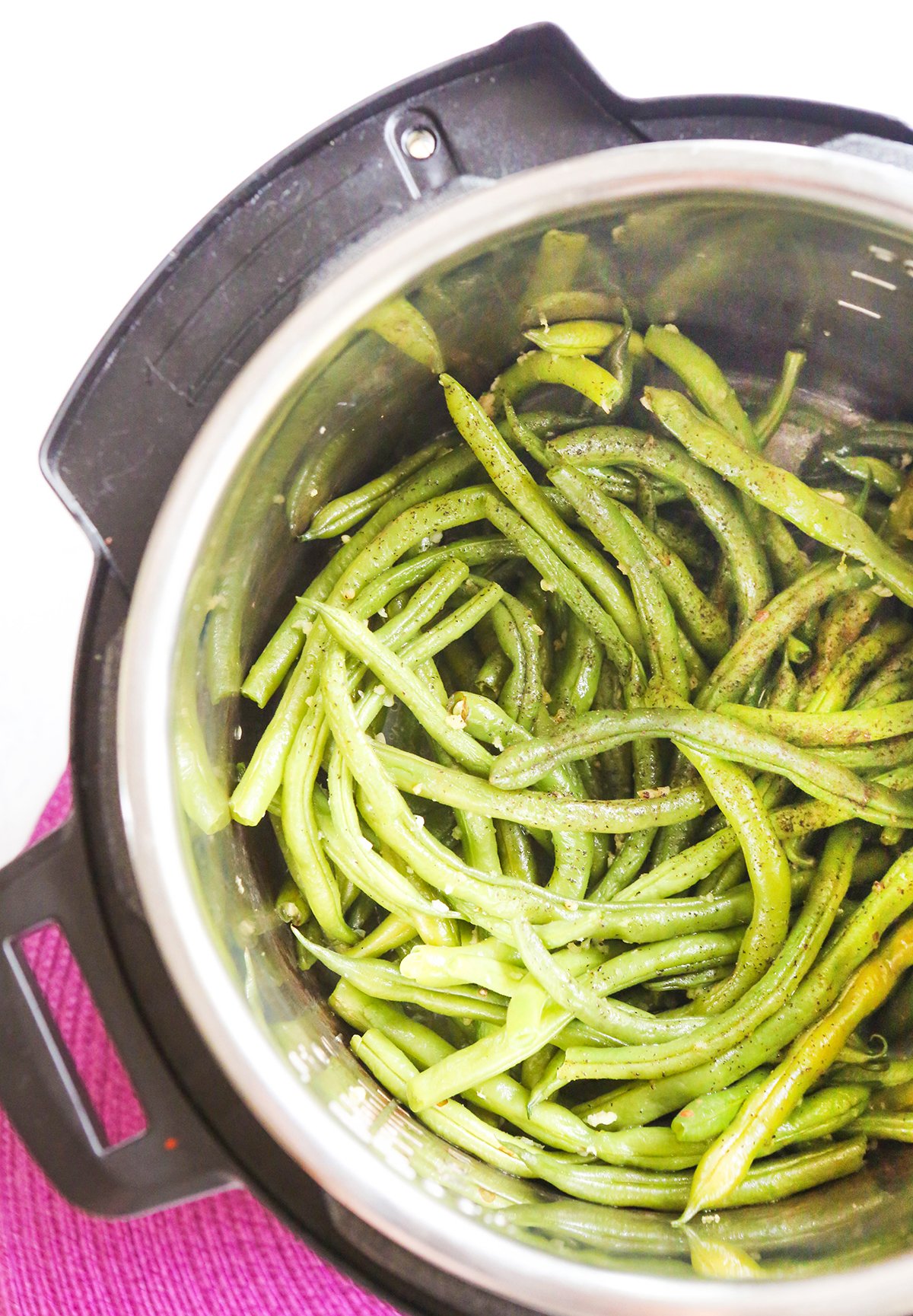 Top view of steamed green beans in an instant pot.