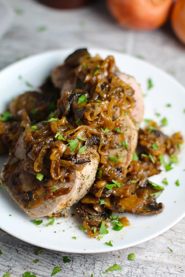 Caramelized onions and mushrooms roast dinner on a platter. 