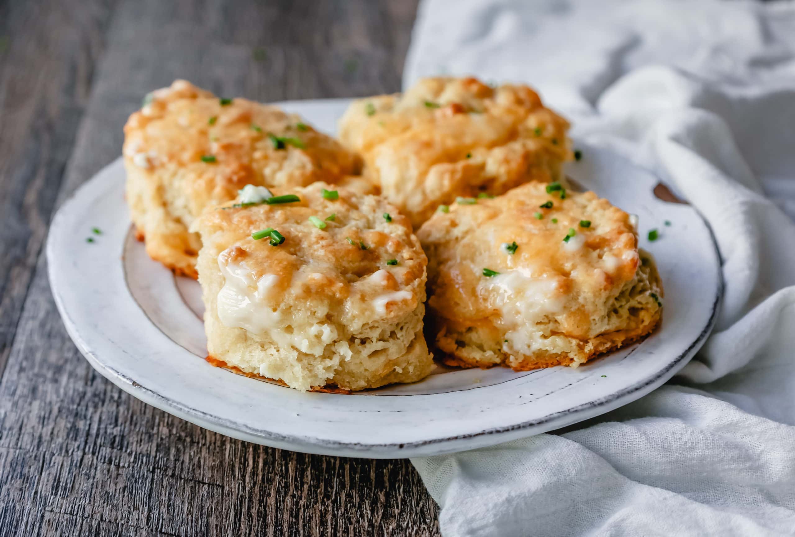 Homemade garlic cheesy biscuits on a plate. 
