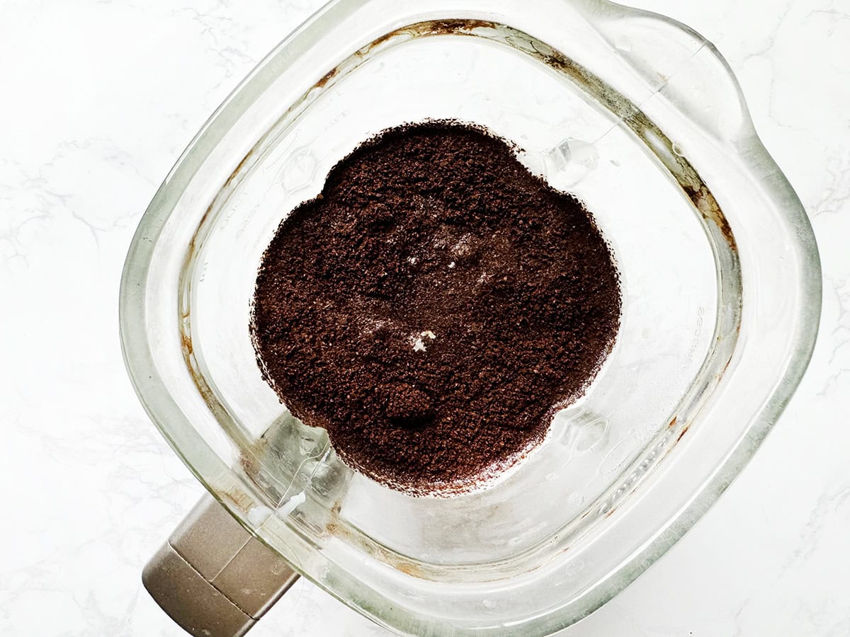 Looking down into a blender filled with ingredients to make Irish cream.