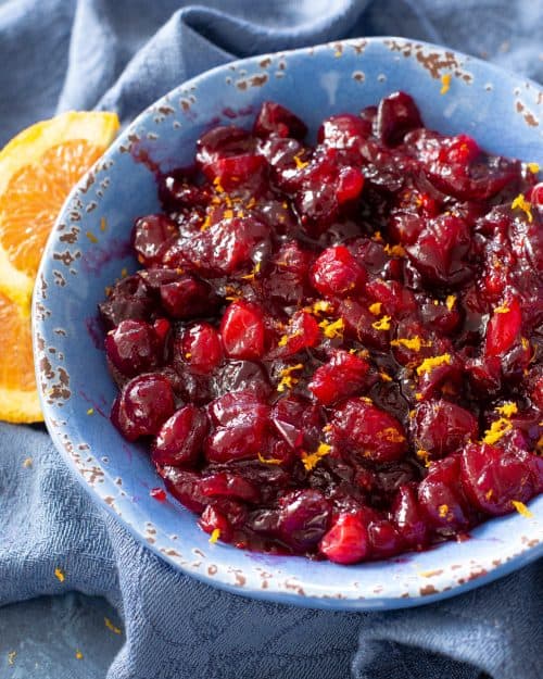 Cranberry sauce in a blue bowl.