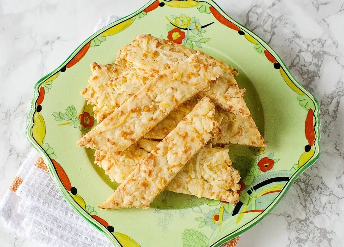 Easy cheese straws on a decorative plate. 