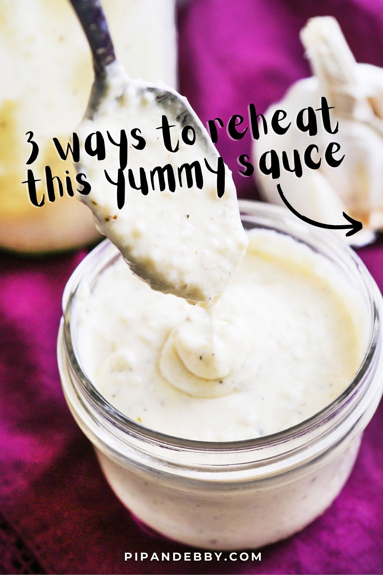 Photo of alfredo sauce in a jar with text overlay reading, "3 ways to reheat this yummy sauce."