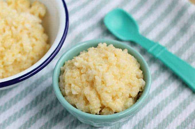 Cheesy rice in a small kids sized bowl. 