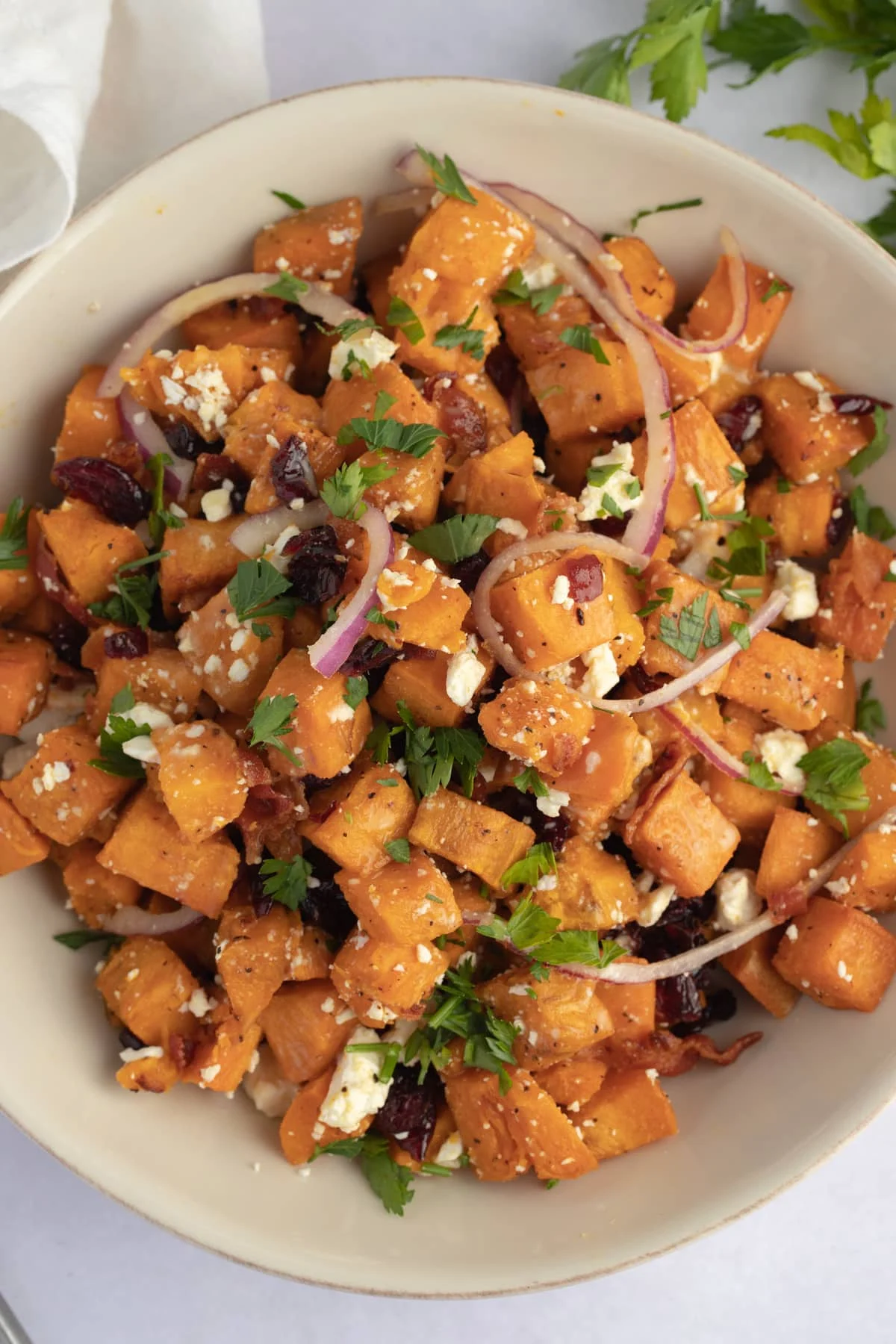 Bowl of warm sweet potato salad. 