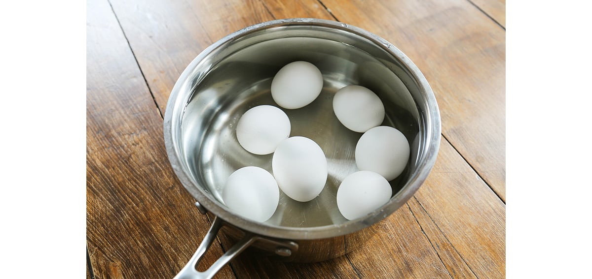 Seven eggs in a pot of water.
