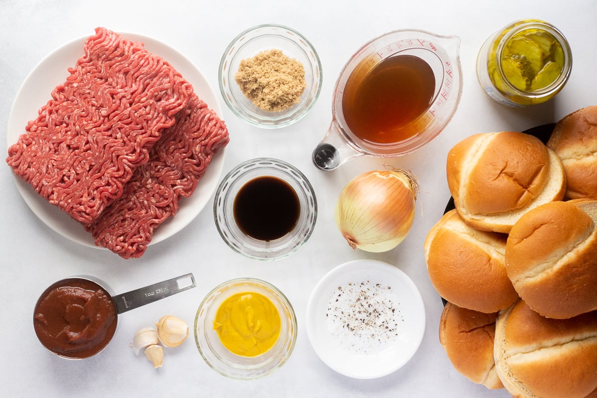 Ingredients for sloppy joes lined up on a white counter.