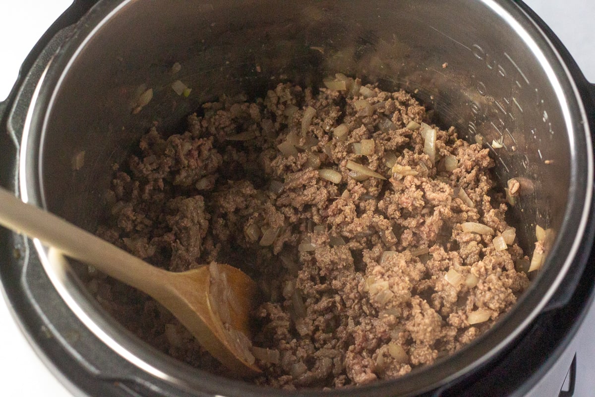 Cooked ground beef and onions in an Instant Pot.