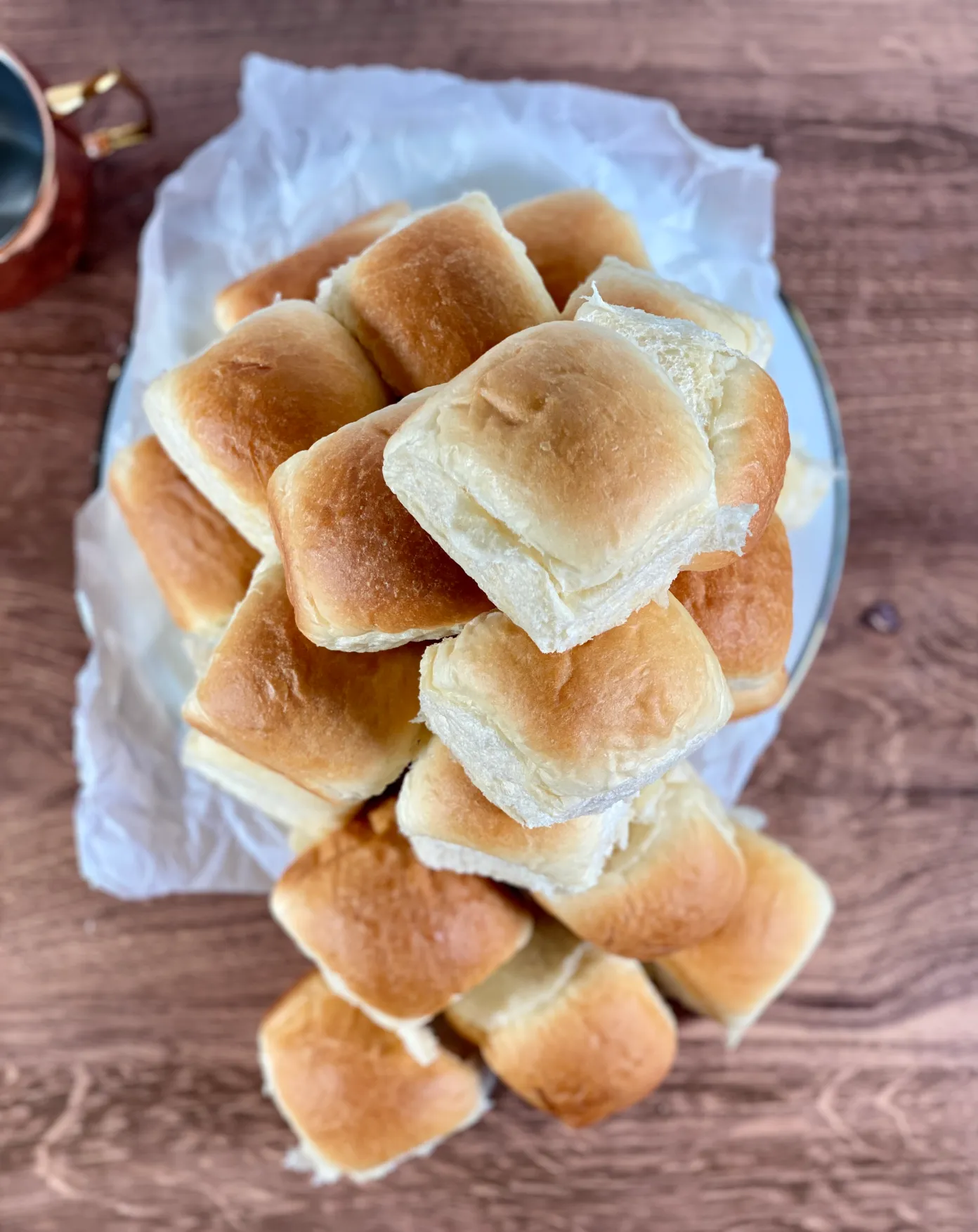 Overflowing bowl of Sunday dinner rolls. 