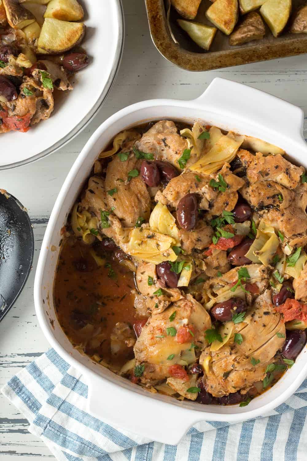 Baking dish of greek chicken thighs. 