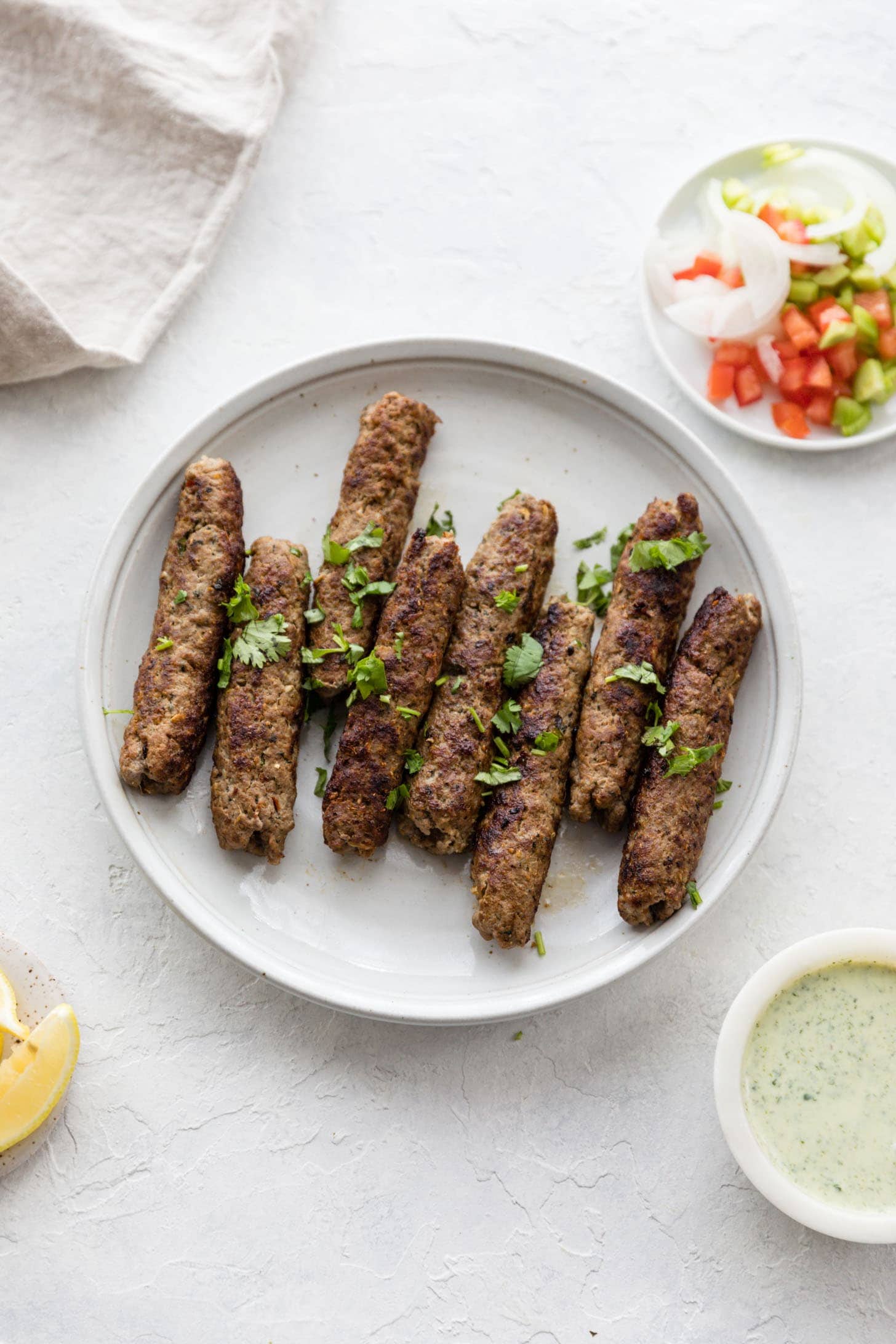 Seekh kebabs on a plate. 
