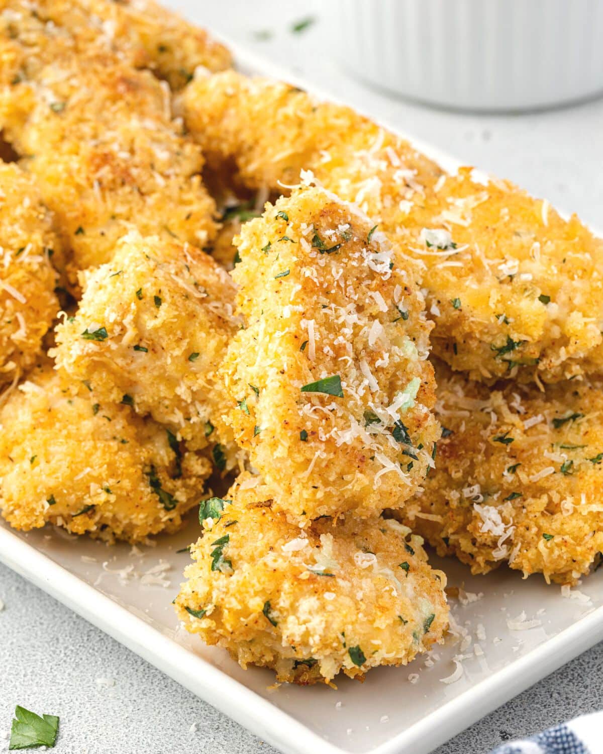 Garlic parmesan boneless wings on a platter. 