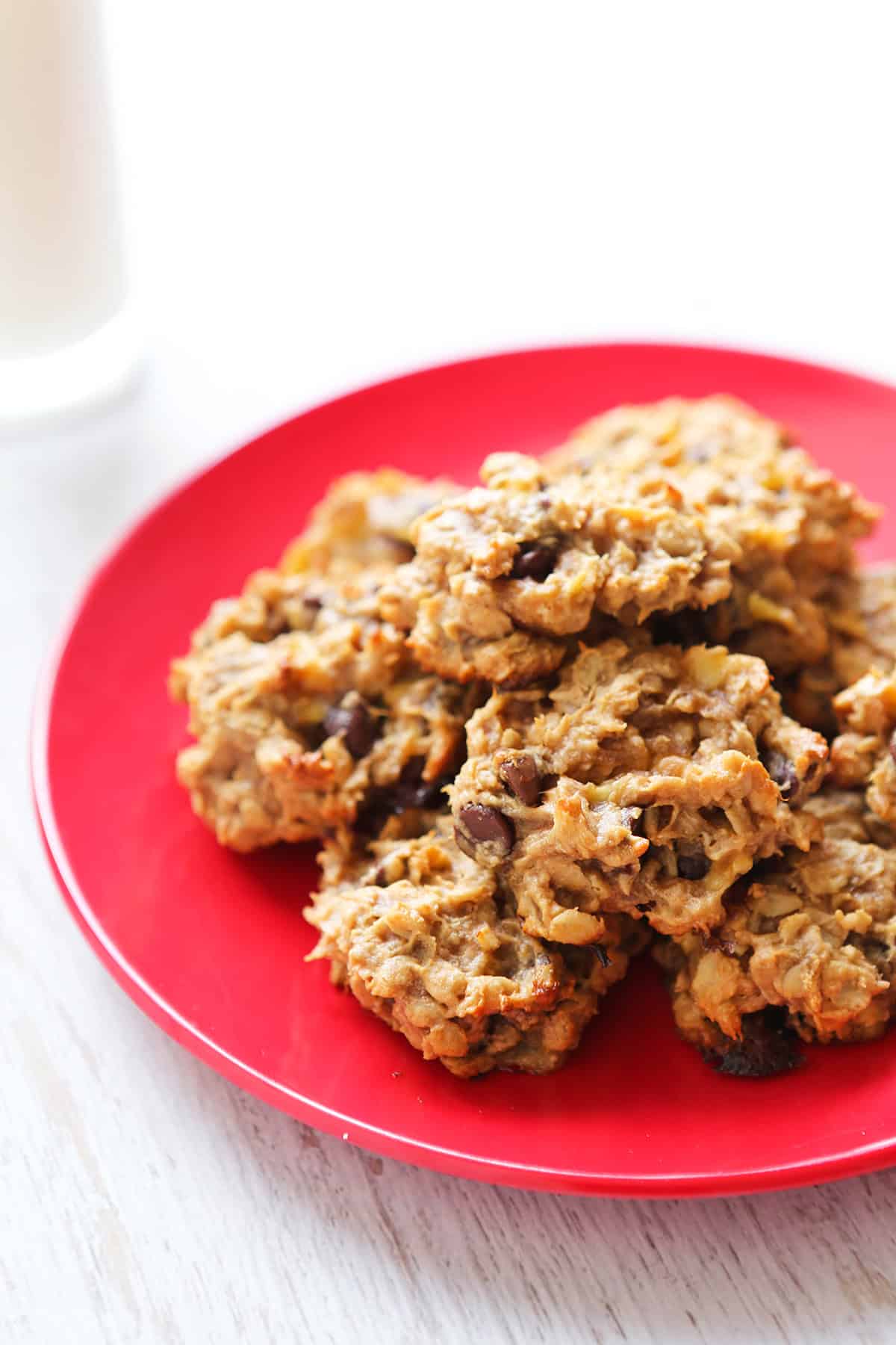 Close-up of homemade peanut butter cookies on a red plate.