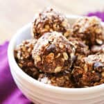 Delicious homemade snack bites with oats, chocolate chips, and nuts in a white bowl.