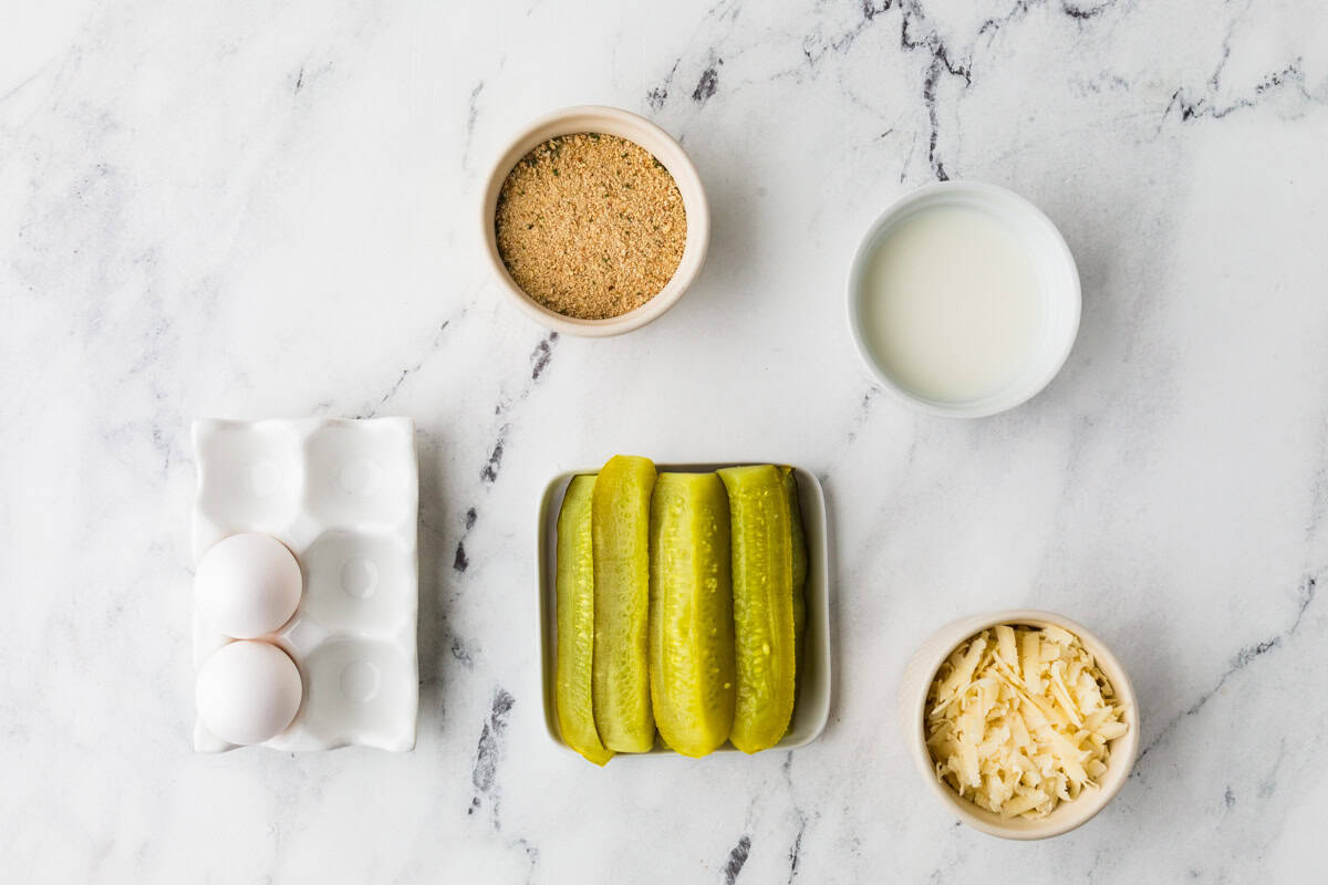 Ingredients for dill pickle fries lined up on a white counter.