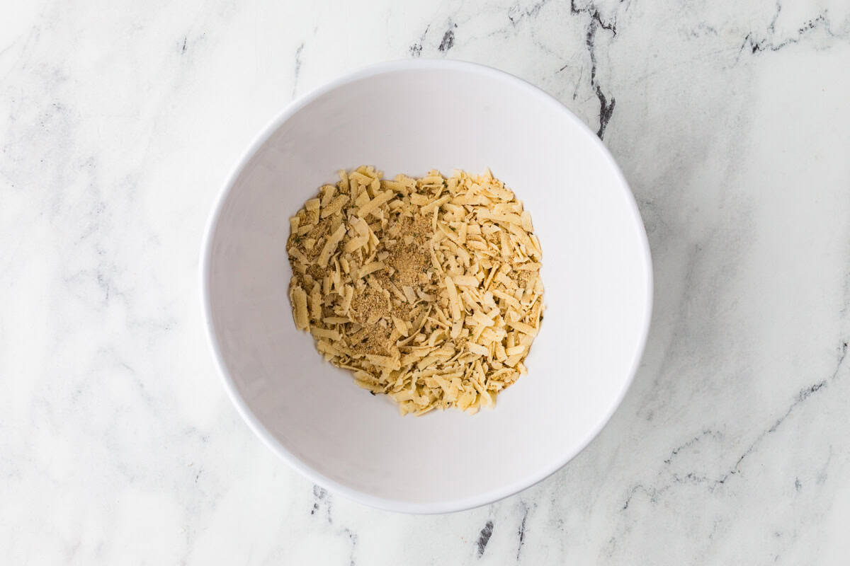 Bowl filled with cheese and breadcrumbs.