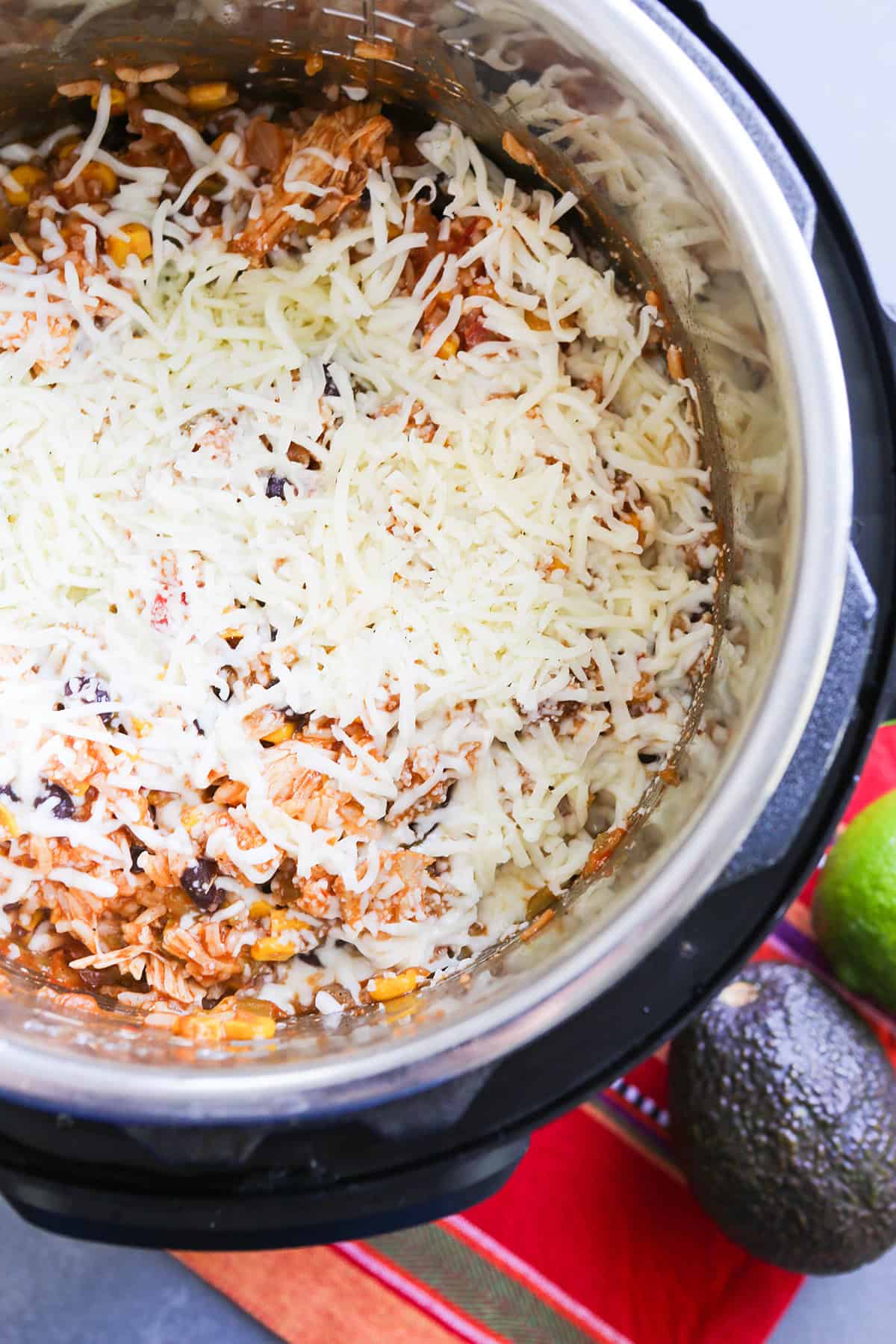 Instant Pot cheesy Mexican rice with shredded cheese and flavorful ingredients.