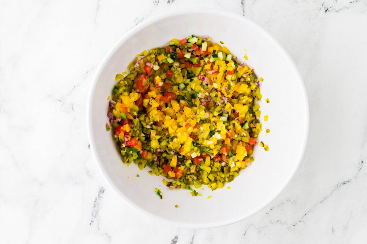 Mixing bowl with ingredients for pickle de gallo just after mixing.