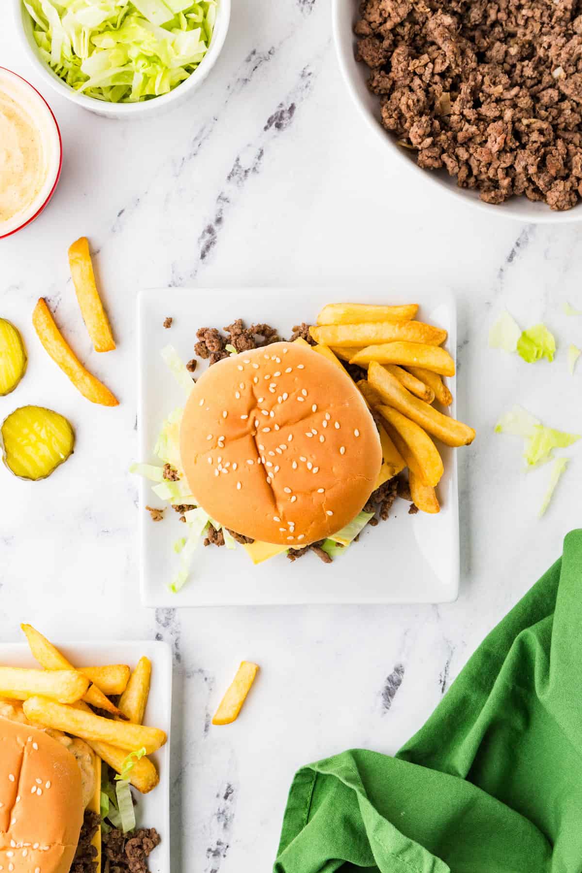 Top view of a plate of sloppy joes and fries.