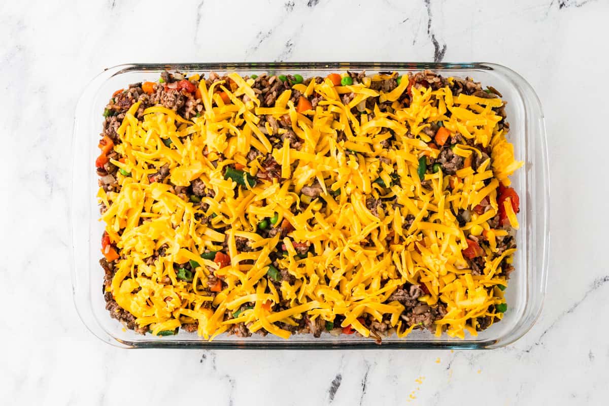 Casserole with meat, veggies and cheese, ready to bake.