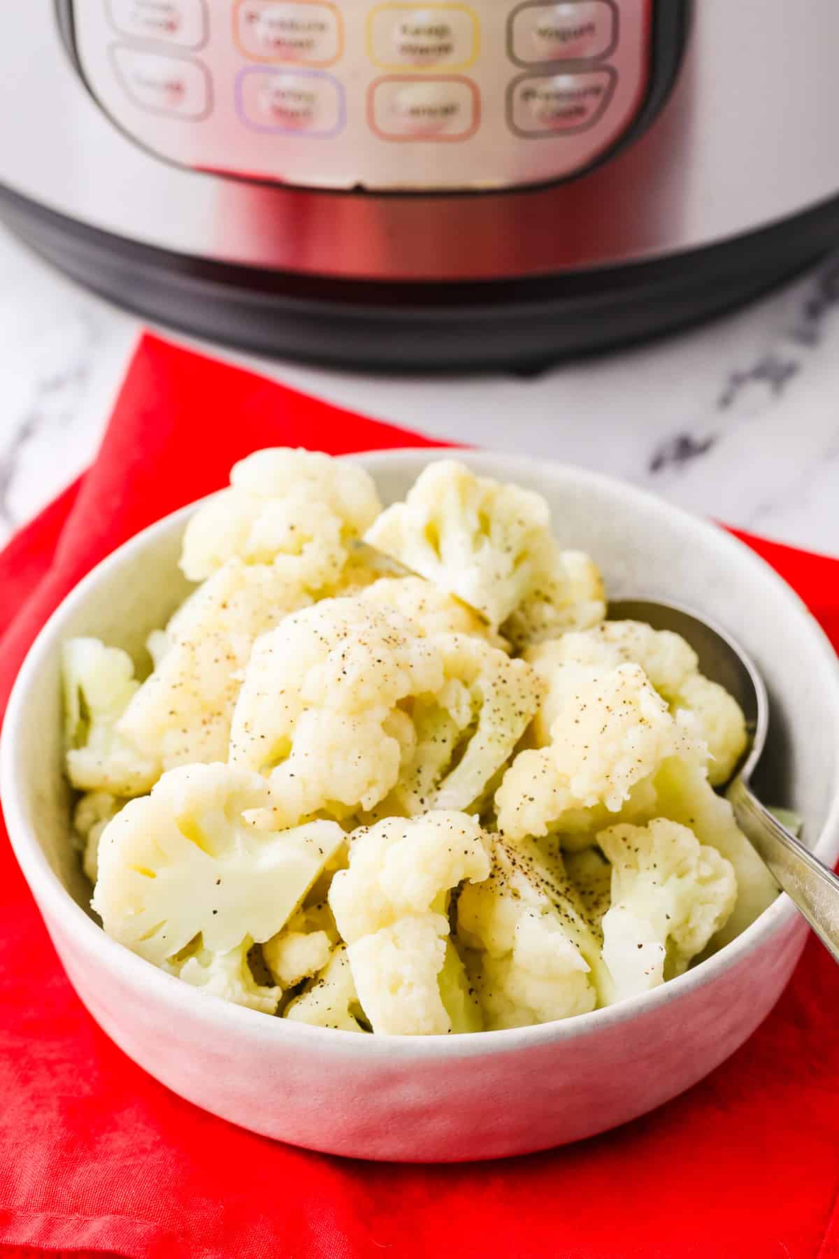 Bowl of cooked cauliflower florets.