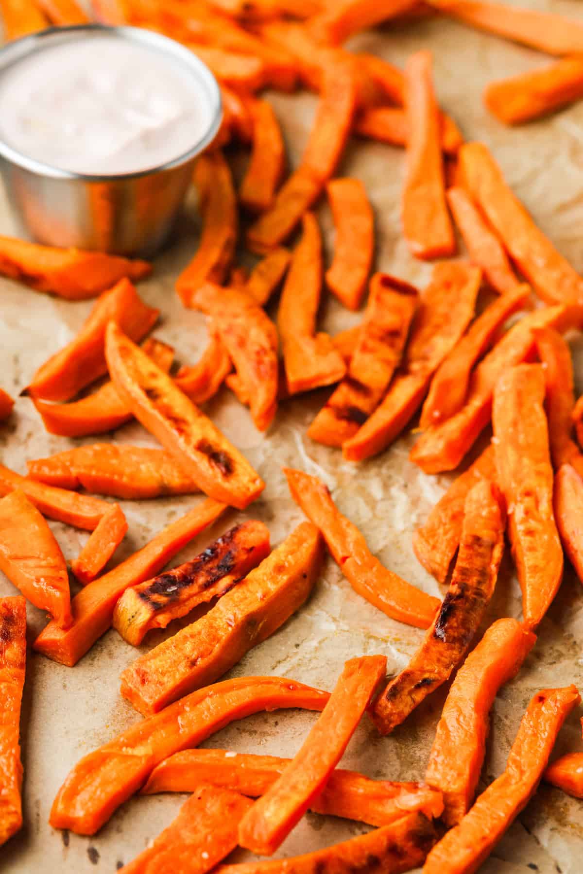 Sweet potato fries on parchment paper.