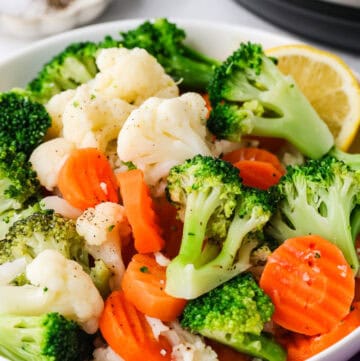 Healthy frozen broccoli, cauliflower, and carrots ready for Instant Pot cooking.