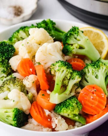 Healthy frozen broccoli, cauliflower, and carrots ready for Instant Pot cooking.