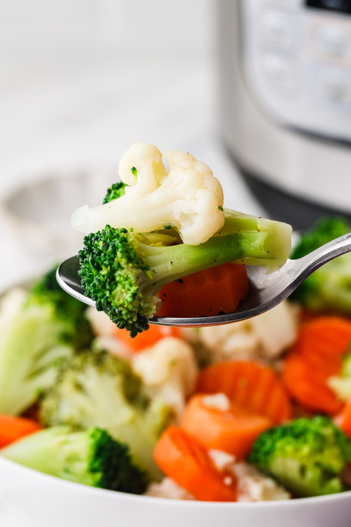 Healthy Instant Pot frozen vegetables with broccoli, cauliflower, and carrots.