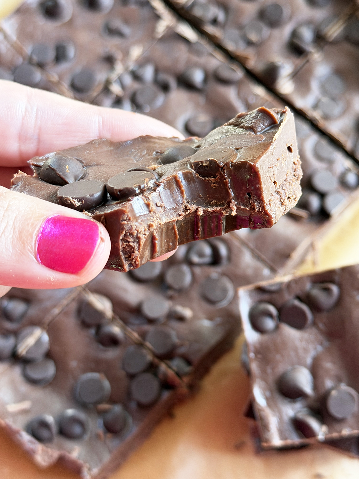 Delicious chocolate chip cookie dough fudge with chocolate chips on top, perfect for sweet cravings.