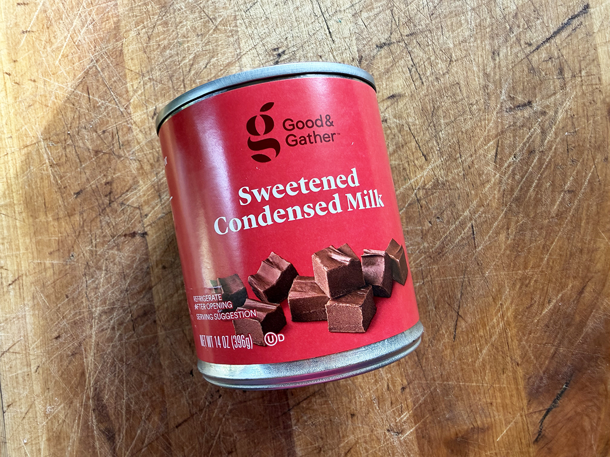 Sweetened condensed milk in a red can, ideal for baking and dessert recipes.