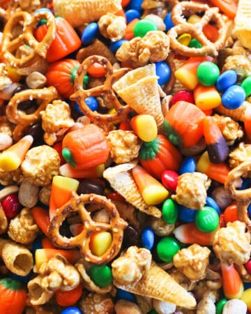 Halloween candy mix with candy corn, pumpkins, pretzels, Bugles, caramel corn, M&Mโs and peanuts